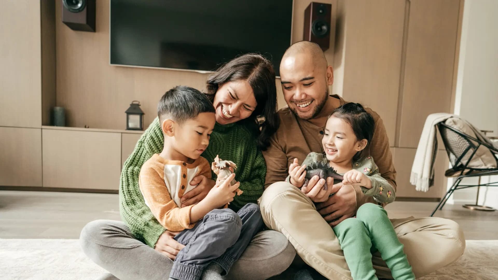 Family sitting in a room